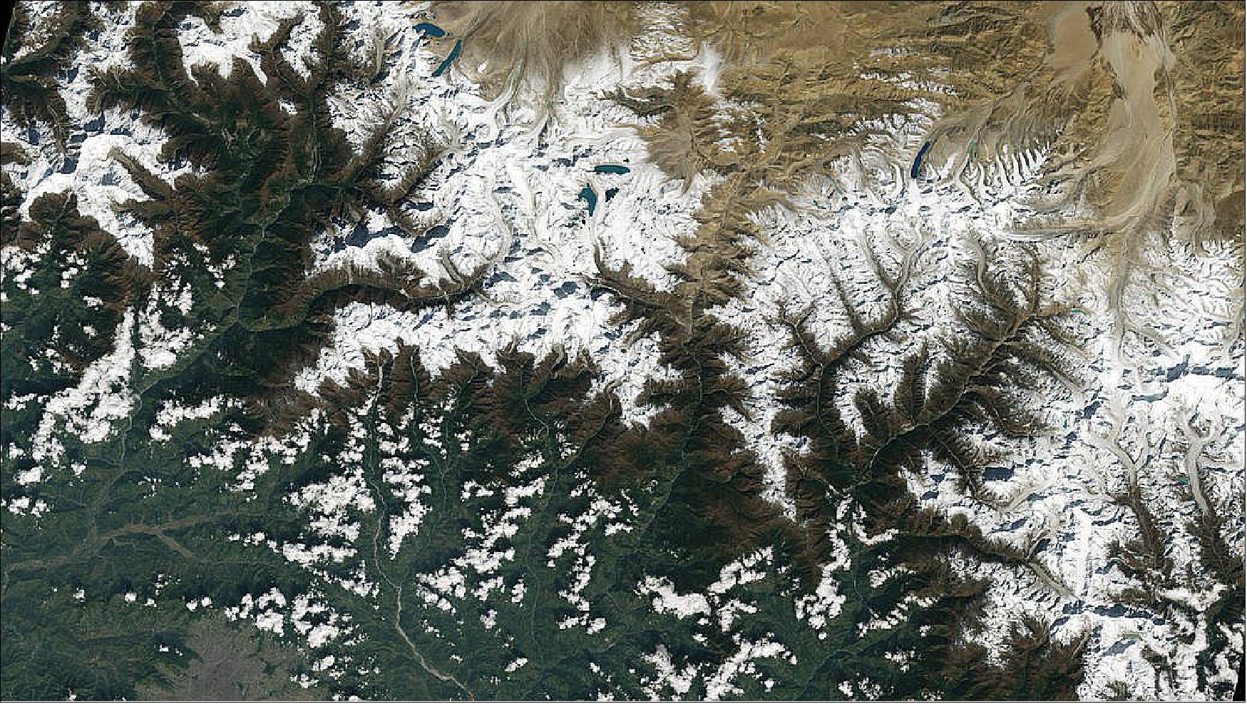 Figure 49: The city of Kathmandu, Nepal, seen at the bottom left of this Landsat-9 image, lies in a valley south of the Himalayan Mountains between Nepal and China. Glaciers, and the lakes formed by glacial meltwater, are visible in the top middle of this image. In High Mountain Asia, many communities rely on meltwater from glaciers – and Landsat can help track how those glaciers are changing in a warming climate. Previous studies with Landsat have documented shrinkage of Himalayan glaciers, as well as changing lake levels the adjacent Tibetan plateau. From Oct. 31, 2021, the first day of data collection for Landsat-9 (image credit:NASA/USGS, Michael Bock)