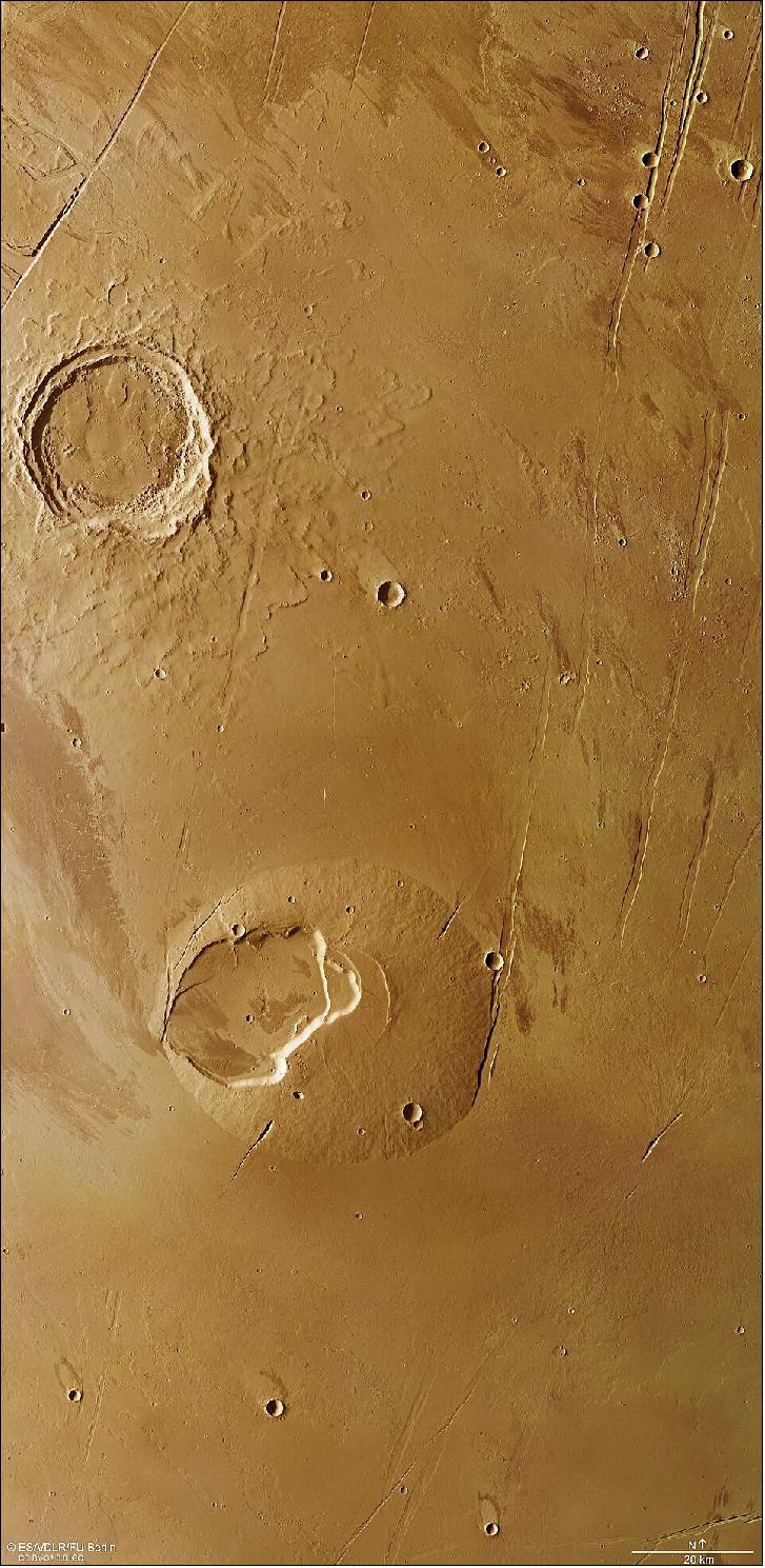 Figure 35: This image from ESA’s Mars Express shows volcanoes, impact craters, tectonic faults, river channels and a lava sea. This image comprises data gathered by ESA’s Mars Express using its High Resolution Stereo Camera (HRSC) on 13 May and 2 June 2021. The colour image was created using data from the nadir channel, the field of view aligned perpendicular to the surface of Mars, and the colour channels of the HRSC. The ground resolution is approximately 17 m/pixel and the images are centered at about 242ºE/19ºN. North is up (image credit: ESA/DLR/FU Berlin, CC BY-SA 3.0 IGO)