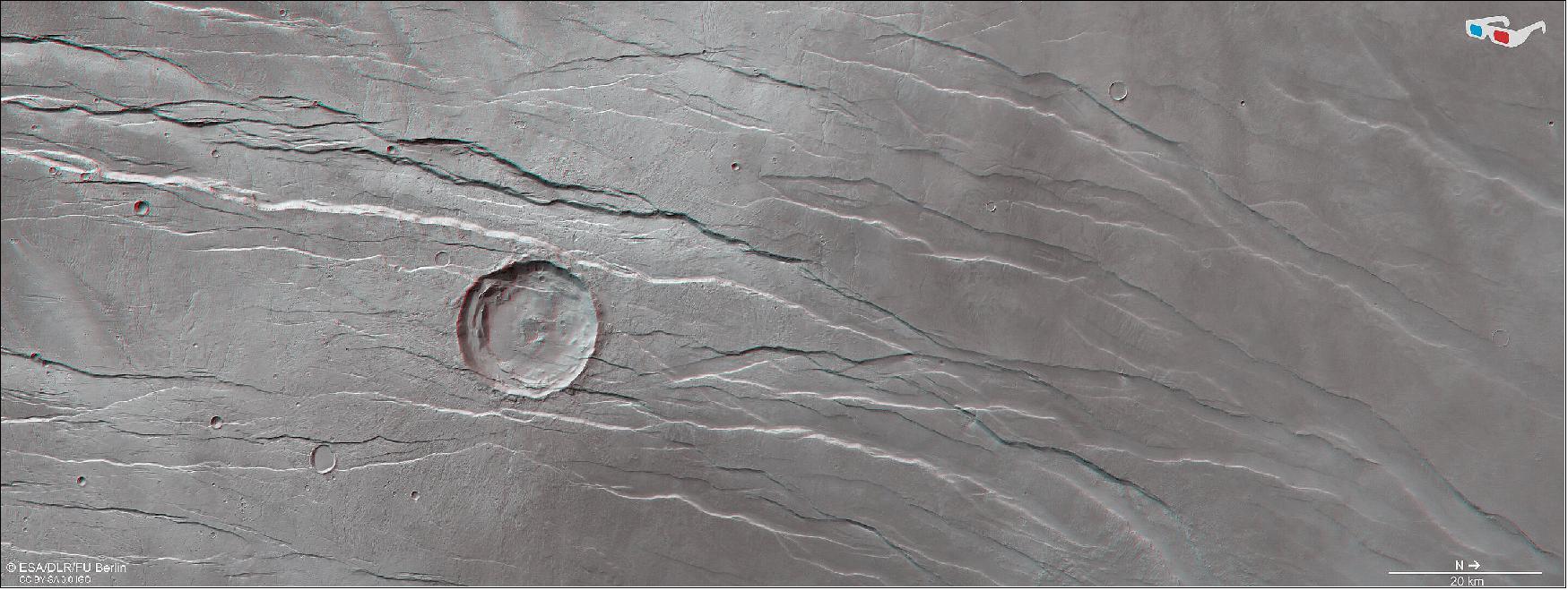 Figure 21: Tantalus Fossae in 3D. This stereoscopic image shows Tantalus Fossae on Mars, and was generated from data captured by the High Resolution Stereo Camera (HRSC) on ESA’s Mars Express orbiter on 19 July 2021 during orbit 22173. The anaglyph, derived from data acquired by the nadir channel and one stereo channel of the HRSC, offers a three-dimensional view when viewed using red-green or red-blue glasses (image credit: ESA/DLR/FU Berlin, CC BY-SA 3.0 IGO)
