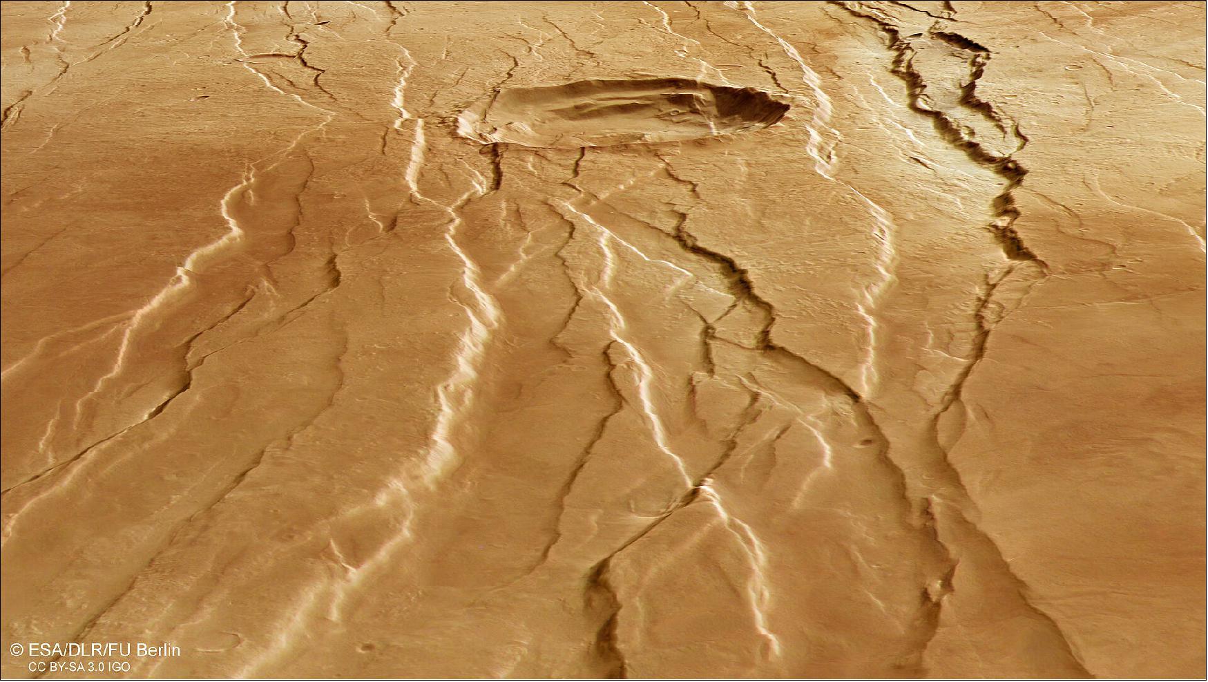 Figure 19: Second perspective view of Tantalus Fossae. This oblique perspective view of Tantalus Fossae on Mars was generated from the digital terrain model and the nadir and colour channels of the High Resolution Stereo Camera on ESA’s Mars Express (image credit: ESA/DLR/FU Berlin, CC BY-SA 3.0 IGO)