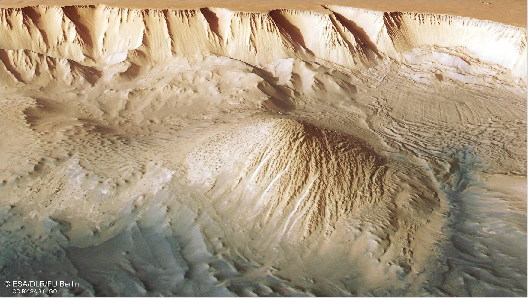 Figure 8: This oblique perspective view of Tithonium Chasmata, which forms part of Mars’ Valles Marineris canyon structure, was generated from the digital terrain model and the nadir and colour channels of the High Resolution Stereo Camera on ESA’s Mars Express. It shows part of the boxes marked 'mound 1' and 'landslide' in this annotated image (image credit: ESA/DLR/FU Berlin, CC BY-SA 3.0 IGO)