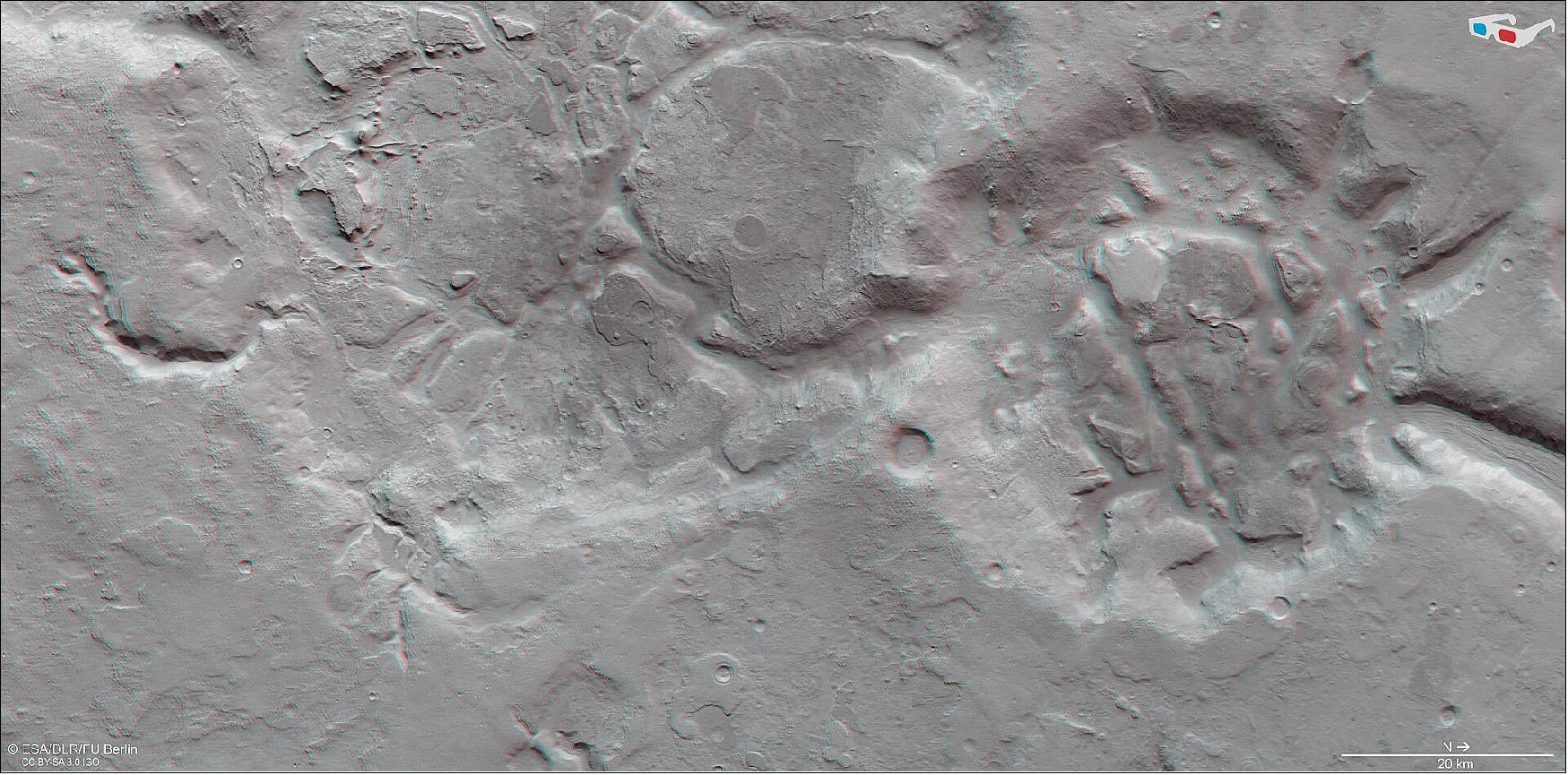 Figure 100: This image shows shows a region of Mars’ surface named Nilosyrtis Mensae in 3D when viewed using red-green or red-blue glasses. This anaglyph was derived from data obtained by the nadir and stereo channels of the HRSC on ESA’s Mars Express during spacecraft orbit 19908. It covers a part of the martian surface centered at about 69ºE/31ºN. North is to the right (image credit: ESA/DLR/FU Berlin, CC BY-SA 3.0 IGO)