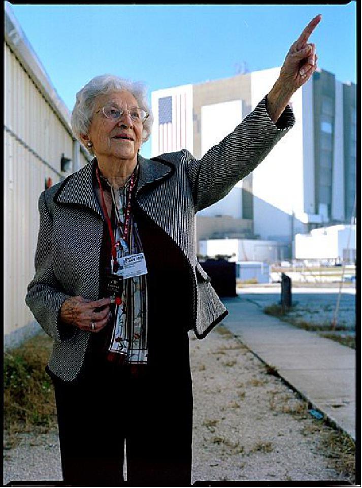 Figure 21: Widow of Pluto discoverer Clyde Tombaugh, Patsy Tombaugh (1912-2012), then 93, points toward Pluto on the afternoon of our launch, Jan. 19, 2006 (photo credit: Michael Soluri)