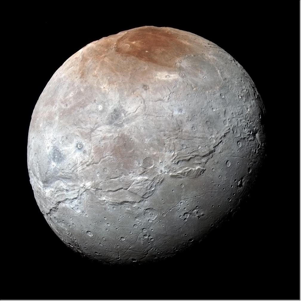 Figure 54: NASA's New Horizons spacecraft captured this high-resolution enhanced color view of Pluto's moon Charon just before closest approach on July 14, 2015. Charon's striking reddish north polar region is informally named Mordor Macula (image credits: NASA, JHU/APL, SwRI)
