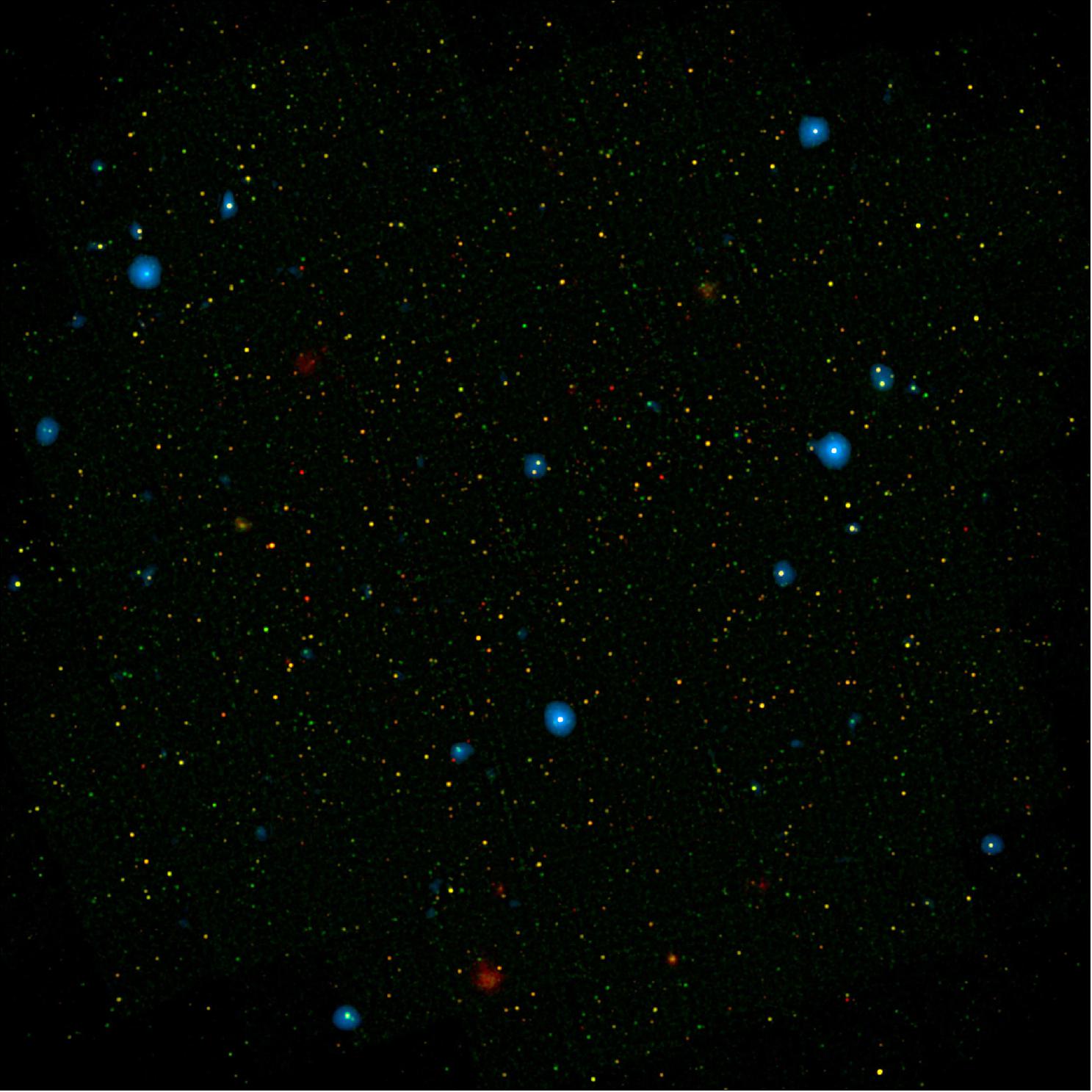 Figure 32: The blue dots in this field of galaxies, known as the COSMOS field, show galaxies that contain supermassive black holes emitting high-energy X-rays. The black holes were detected by NASA's NuSTAR, which spotted 32 such black holes in this field and has observed hundreds across the whole sky so far.