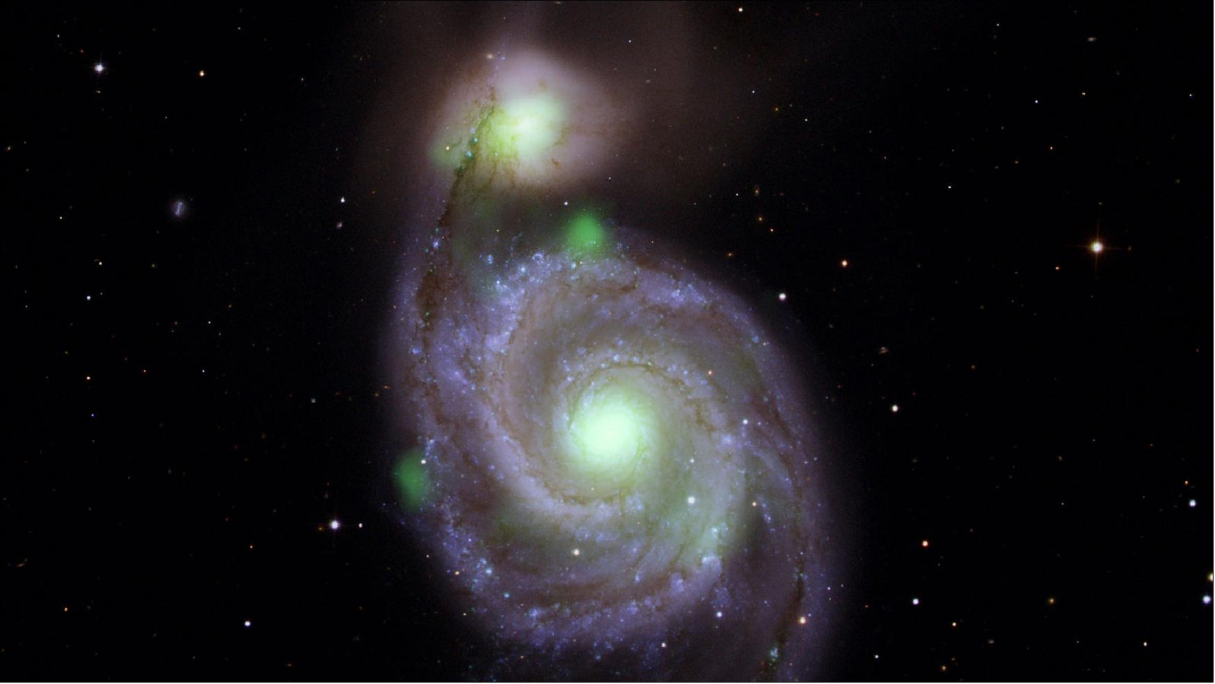Figure 22: Bright green sources of high-energy X-ray light captured by NASA's NuSTAR mission are overlaid on an optical-light image of the Whirlpool galaxy (in the center of the image) and its companion galaxy, M51b (the bright greenish-white spot above the Whirlpool), taken by the Sloan Digital Sky Survey (image credit: NASA/JPL-Caltech, IPAC)