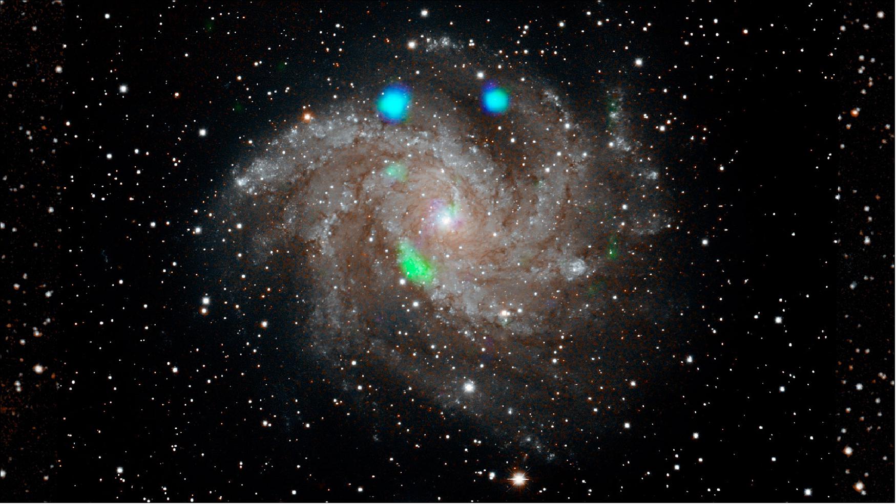 Figure 21: This visible-light image of the Fireworks galaxy (NGC 6946) comes from the Digital Sky Survey, and is overlaid with data from NASA's NuSTAR observatory (in blue and green), image credit: NASA/JPL-Caltech