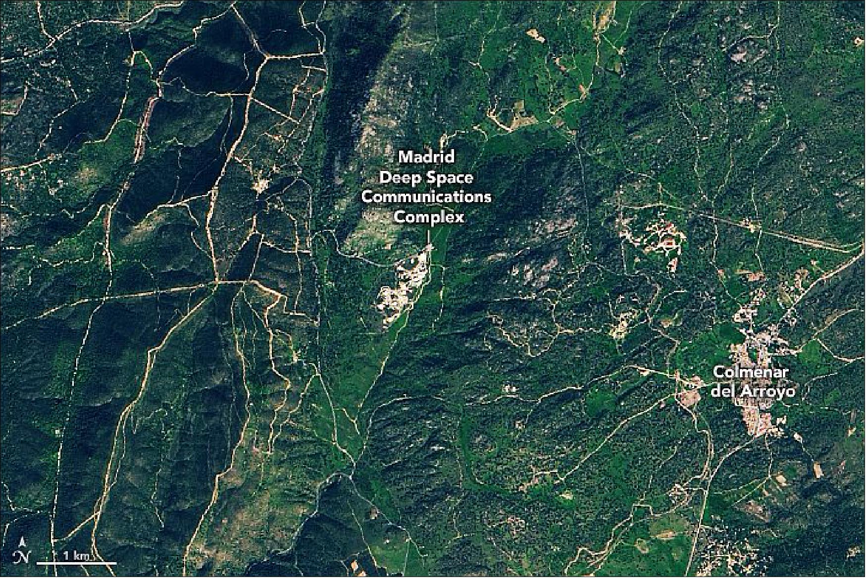 Figure 15: On March 17, 2021, the Operational Land Imager (OLI) on Landsat-8 acquired this natural-color image of one of the communications hubs in Robledo de Chavela, about 50 km (30 miles) west of Madrid, Spain. The complex has several large radio antennas with parabolic dishes that appear as white circles in the Landsat image. The location was chosen because it was equidistant to DSN stations in Goldstone, California and Canberra, Australia. The strategic placement allows for continuous communication with spacecraft as Earth rotates (image credit: NASA Earth Observatory image by Lauren Dauphin, using Landsat data from the U.S. Geological Survey. Story by Adam Voiland)