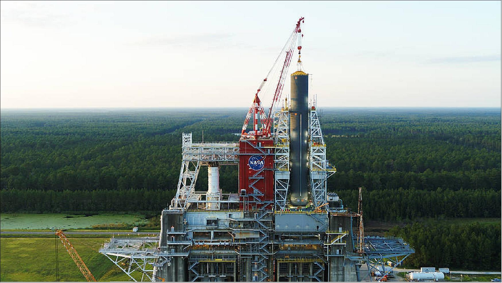 Figure 28: NASA’s Space Launch System (SLS) core stage pathfinder is positioned in the B-2 Test Stand at NASA’s Stennis Space Center near Bay St. Louis, Mississippi. The Pathfinder is the same shape, size and weight (without propellants loaded) as the actual SLS core stage flight hardware. Stennis work crews used it in August to train and practice handling and lifting techniques needed for the core stage flight hardware when it arrives at Stennis for testing in 2020 (image credit: NASA)
