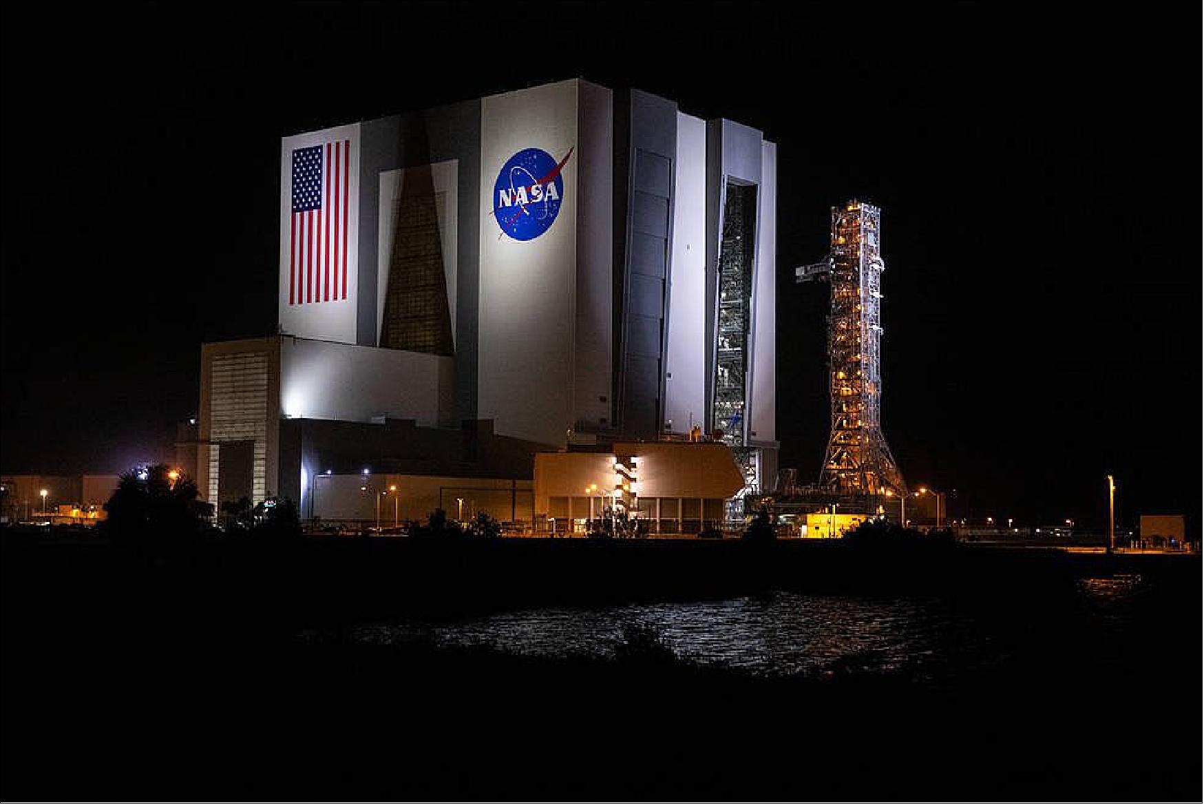 Figure 20: The mobile launcher for Artemis I begins rollout from the Vehicle Assembly Building atop crawler-transporter 2 in the early morning on Oct. 20, 2020, at NASA's Kennedy Space Center in Florida (image credit: NASA, Ben Smegelsky)