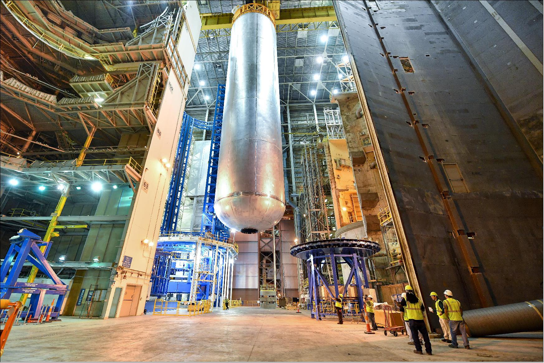 Figure 3: Welding is complete on the largest piece of the core stage that will provide the fuel for the first flight of NASA's new rocket, the Space Launch System, with the Orion spacecraft in 2018. The core stage liquid hydrogen tank has completed welding on the Vertical Assembly Center at NASA's Michoud Assembly Facility in New Orleans. Standing more than 40 m tall and 8.4 m in diameter, the liquid hydrogen tank is the largest cryogenic fuel tank for a rocket in the world. The liquid hydrogen tank and liquid oxygen tank are part of the core stage — the "backbone" of the SLS rocket that will stand at more than 61 m tall. Together, the tanks will hold 733,000 gallons (2775 m3) of propellant and feed the vehicle's four RS-25 engines to produce a total of 2 million pounds of thrust (8896 kN) This is the second major piece of core stage flight hardware to finish full welding on the Vertical Assembly Center. The core stage flight engine section completed welding in April 2016. More than 1.7 miles of welds have been completed for core stage hardware at Michoud. Traveling to deep space requires a large rocket that can carry huge payloads, and SLS will have the payload capacity needed to carry crew and cargo for future exploration missions, including NASA's Journey to Mars. 5)