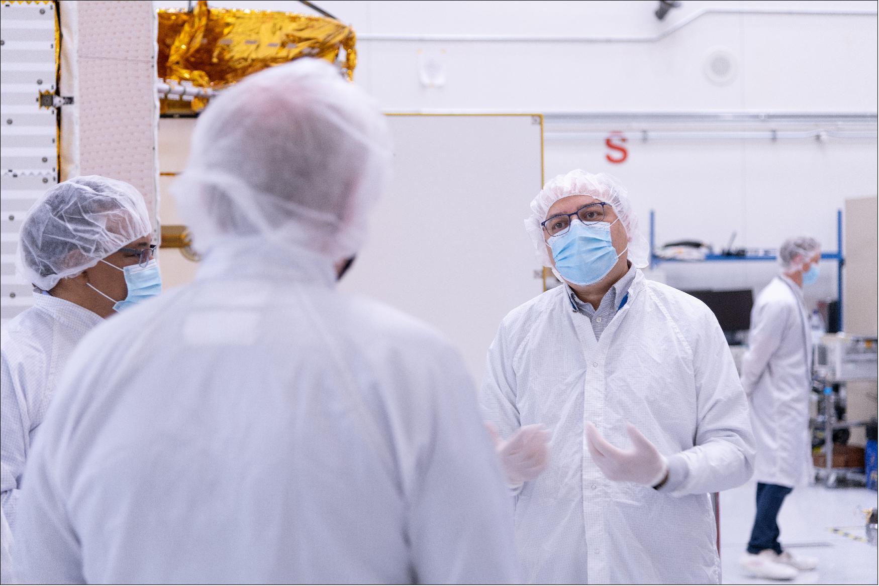 Figure 9: Project Manger Parage Vaze stands in the JPL clean room where the SWOT satellite is being assembled. The spacecraft will help researchers survey the amount and distribution of Earth's surface water, including fresh water in lakes and rivers, as well as the ocean (image credit: NASA/JPL-Caltech)