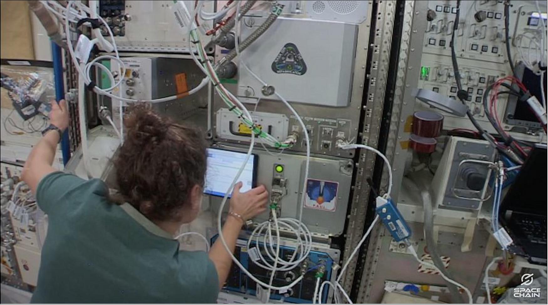Figure 8: NASA astronaut Jessica Meir installed SpaceChain's multisignature blockchain payload housed in a 1U Nanoracks Nanolab on the International Space Station in 2020 (image credit: YouTube screenshot)