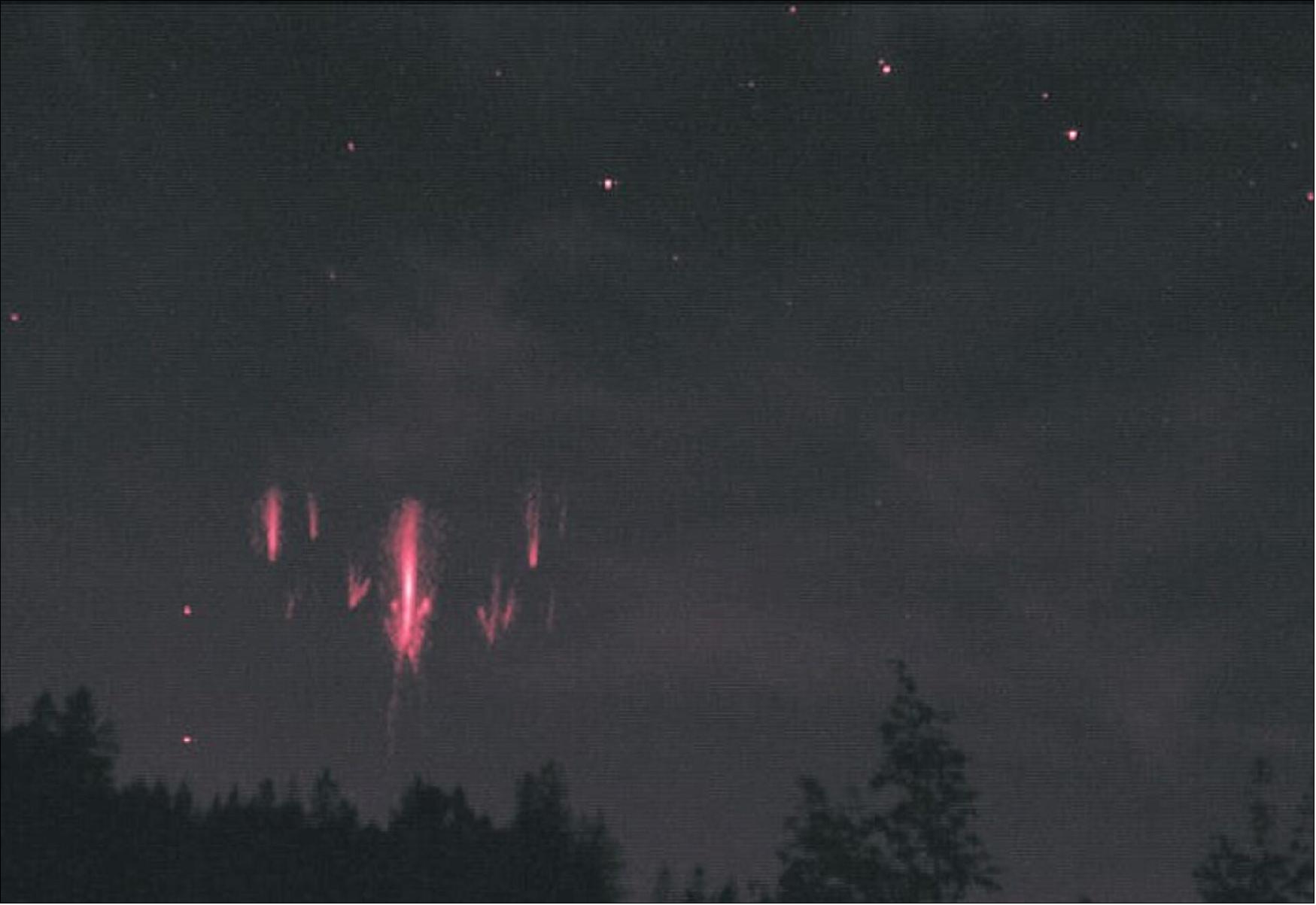 Figure 51: Sprites seen over the Czech Republic and detected by Swarm. This photograph of lightning sprites was taken from the Czech Republic in August 2017 and it was the first time that an event of this type left its signature simultaneously in satellite data. Two of ESA’s Swarm satellites registered perturbations in their magnetic field data as they passed over Poland. The distance between the ground tracks of the satellites and the center of the storm was about 500 km. The event caused fluctuations in the scalar magnetic field with amplitudes reaching 0.2 nT. Now a scientific paper has been published about using Swarm to help provide evidence of links between transient luminous events and magnetic-field fluctuations in the upper ionosphere (image credit: M. Popek) 65)