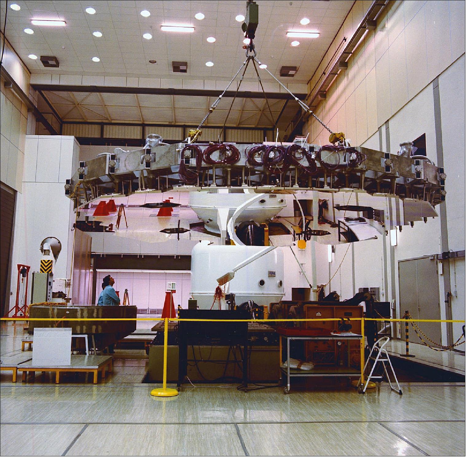 Figure 71: The giant 121-segment mirror array used to reflect simulated sunlight into the largest vacuum chamber in Europe seen being hoisted into position within ESA’s technical heart back in 1986 (image credit: ESA, CC BY-SA 3.0 IGO)