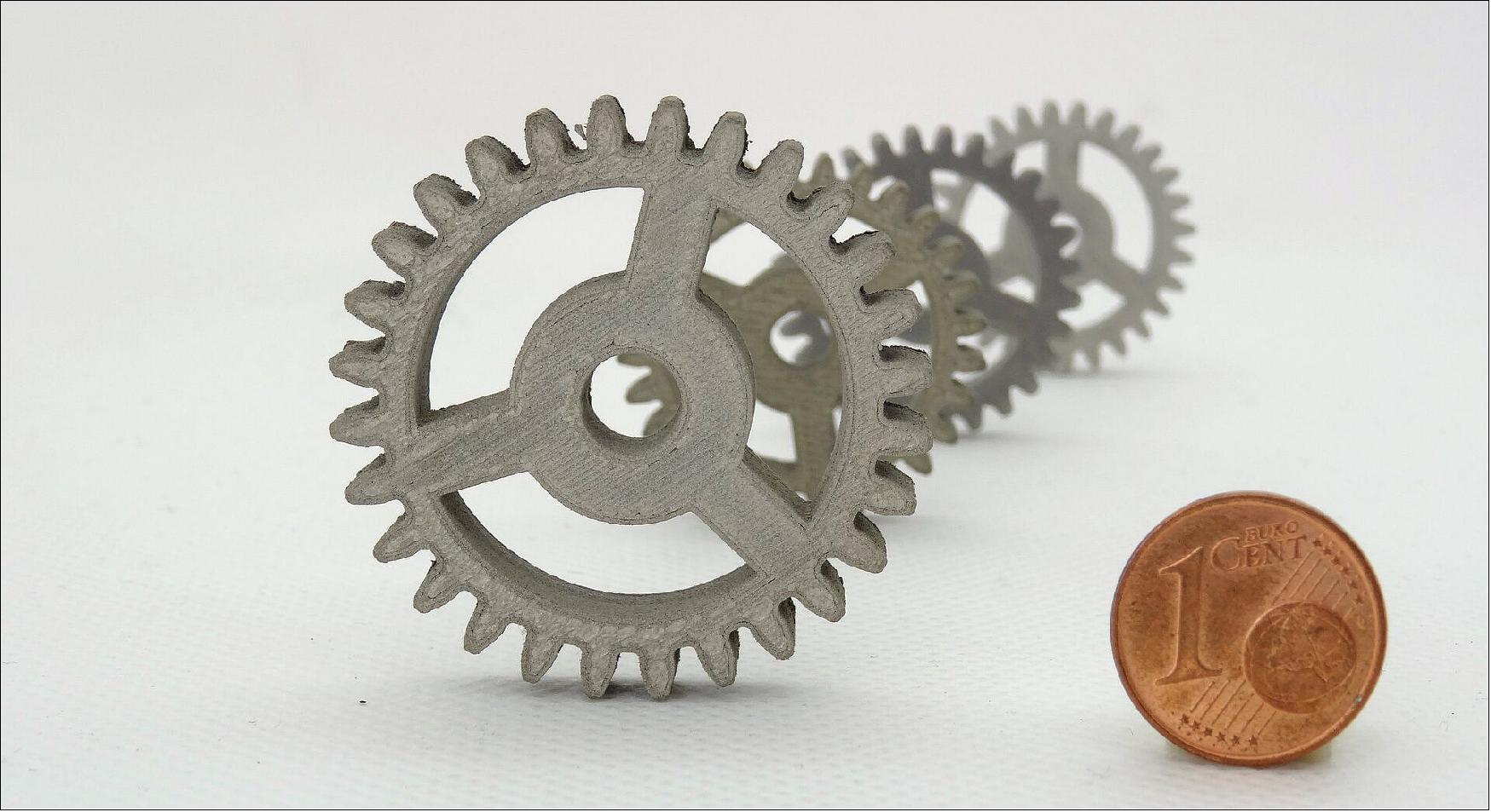 Figure 21: These spur gears – seen here with an euro 1 cent coin for scale – have been produced in stainless steel to a space standard of quality using nothing more than an off-the-shelf desktop 3D printer (image credit: TIWARI Scientific Instruments)