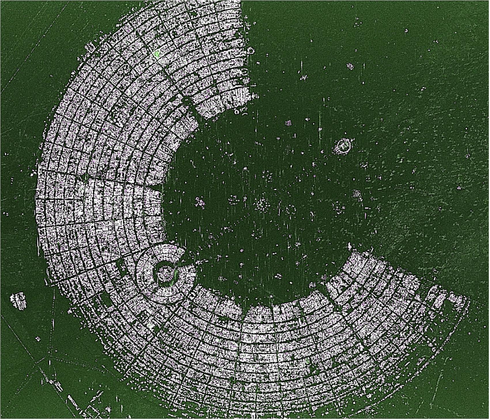 Figure 28: Staring Spotlight scene of 3 km x 3.5 km with a resolution of 1m x 1m, showing the Burning Man Festival 2013, a 'Tent City' arising in a semicircle around its central point in Black Rock City, Nevada, USA. The original azimuth resolution of 24 cm was reduced to 1 m, due to multi-looking, in order to improve the radiometric resolution (image credit: DLR)