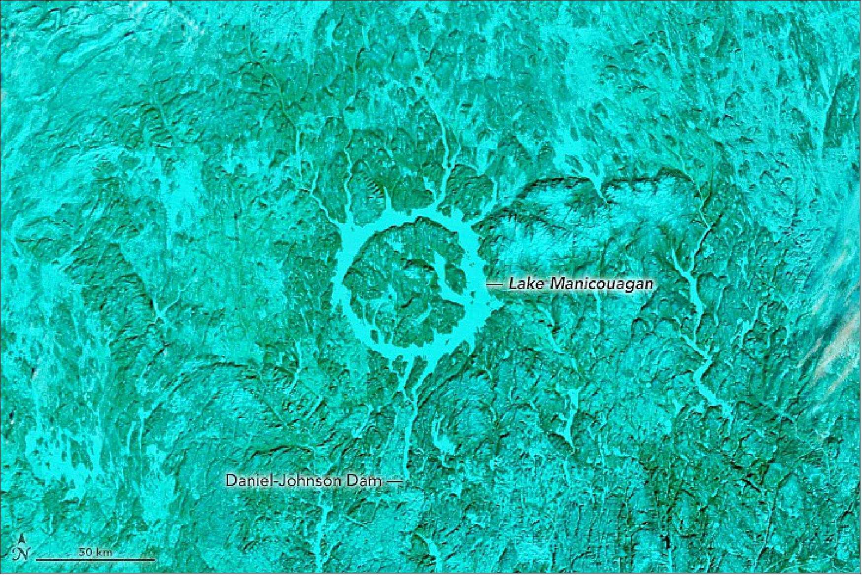 Figure 32: In the false-color image, which uses MODIS bands 7-2-1, snow or ice appears electric blue and vegetation appears green. A blanket of snow covering the surrounding vegetation gives it a greenish-blue color (image credit: NASA Earth Observatory)