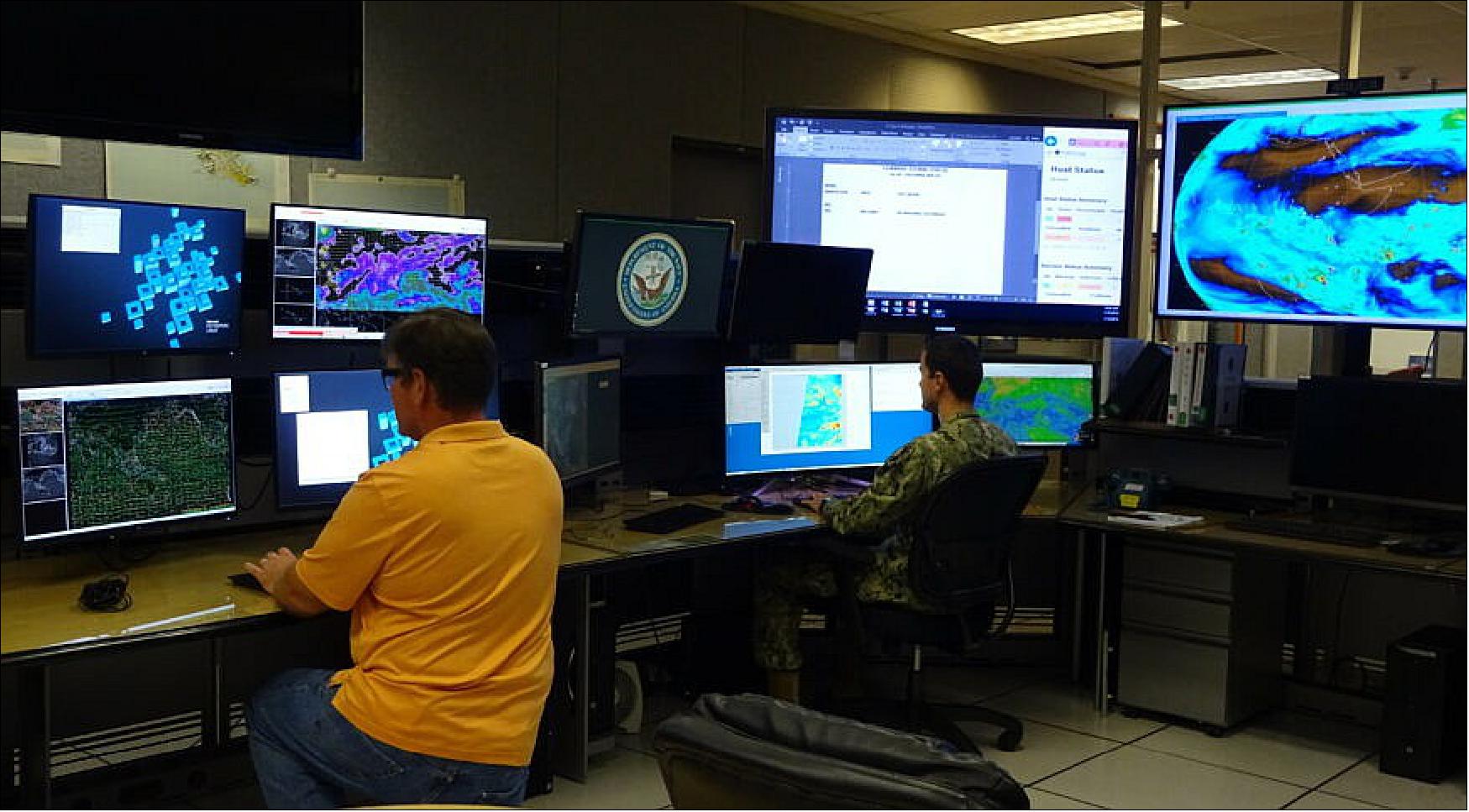 Figure 28: U.S. Navy operators at Pearl Harbor, HI, view satellite imagery at the Joint Typhoon Warning Center (image credit: U.S. Navy)
