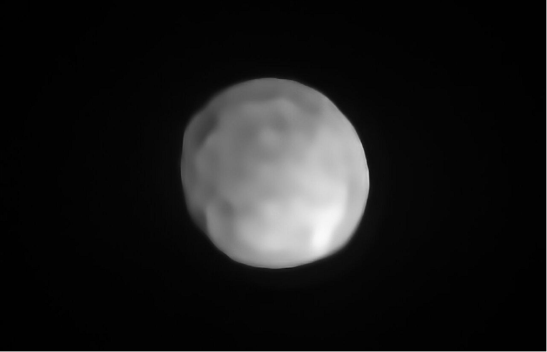 Figure 46: A new SPHERE/VLT image of Hygiea, which could be the Solar System’s smallest dwarf planet yet. As an object in the main asteroid belt, Hygiea satisfies right away three of the four requirements to be classified as a dwarf planet: it orbits around the Sun, it is not a moon and, unlike a planet, it has not cleared the neighborhood around its orbit. The final requirement is that it have enough mass that its own gravity pulls it into a roughly spherical shape. This is what VLT observations have now revealed about Hygiea [image credit: ESO/P. Vernazza et al./MISTRAL algorithm (ONERA/CNRS)]