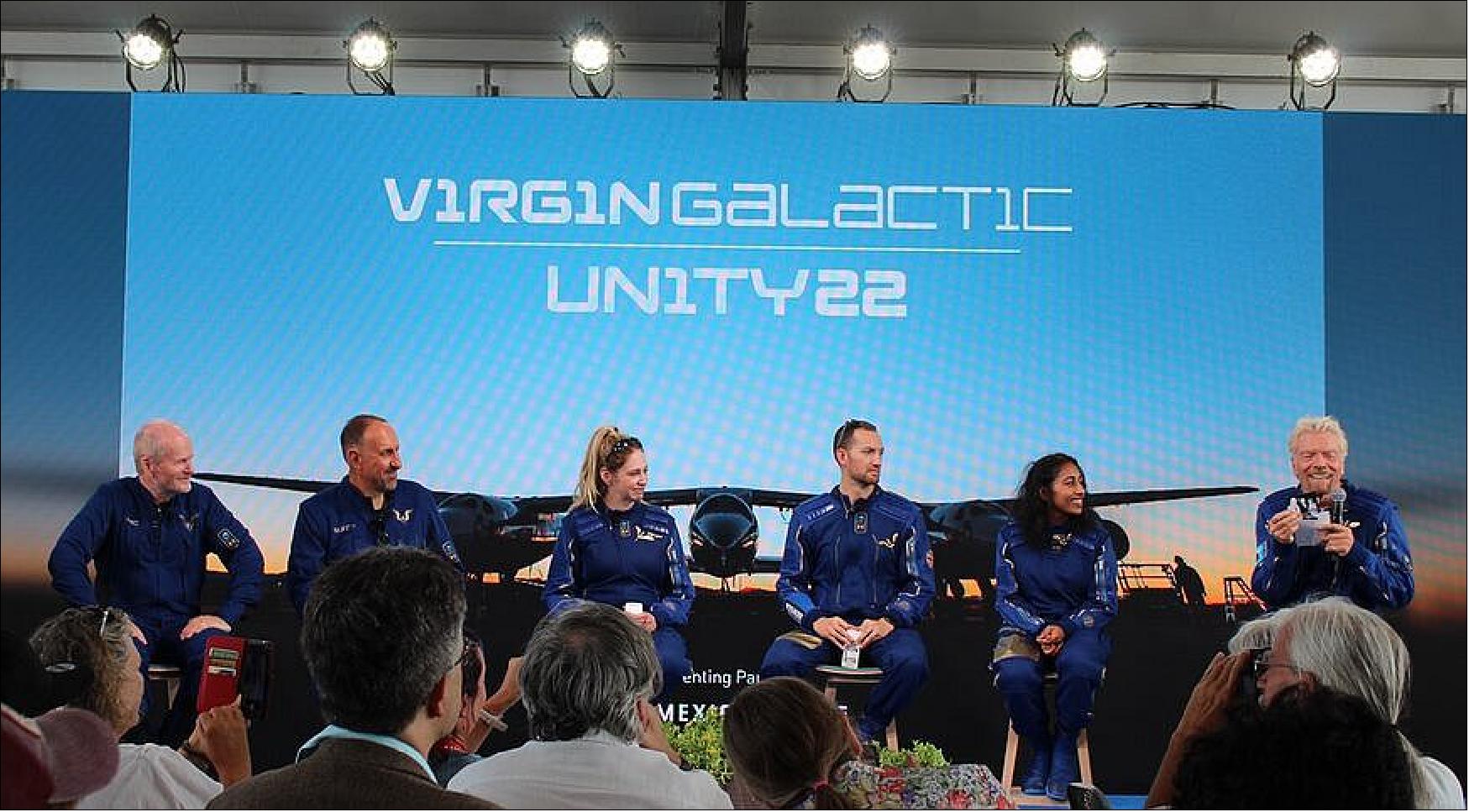 Figure 16: Richard Branson (right) discusses the July 11 SpaceShipTwo flight he was on at a post-flight briefing along with the rest of the crew (from left): Dave Mackay, Mike Masucci, Beth Moses, Colin Bennett and Sirisha Bandla (image credit: SpaceNews/Jeff Foust)