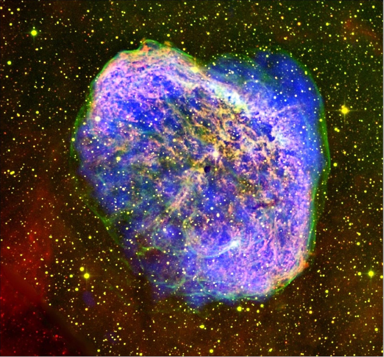 Figure 91: The image shows the detailed structure of the Crescent Nebula that shed a shell of material as it expanded into a red giant some 200 000 years ago. Fast winds emitted more recently have now collided with that material, causing the gasses in the bubble to heat up and emit X-rays, seen as blue in the image. Other features can also be seen, such as the green hue, generated by oxygen atoms, where the star’s wind is interacting with the surrounding interstellar medium. Density differences in the surrounding material may give rise to the different structures, such as the extended bubble segment to the top right (image credit: ESA/XMM-Newton, J. Toalá & D. Goldman)