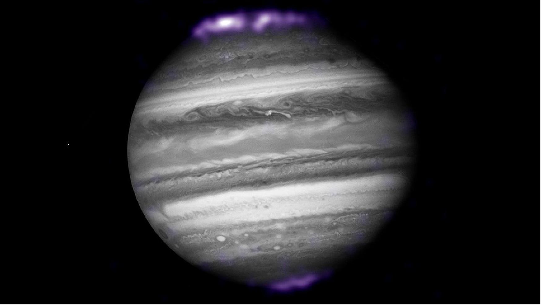 Figure 23: The purple hues in this image show X-ray emissions from Jupiter’s auroras, detected by NASA’s Chandra Space Telescope in 2007. They are overlaid on an image of Jupiter taken by NASA’s Hubble Space Telescope. Jupiter is the only gas giant planet where scientists have detected X-ray auroras [image credits: (X-ray) NASA/CXC/SwRI/R. Gladstone et al.; (Optical) NASA/ESA/Hubble Heritage (AURA/STScI)]
