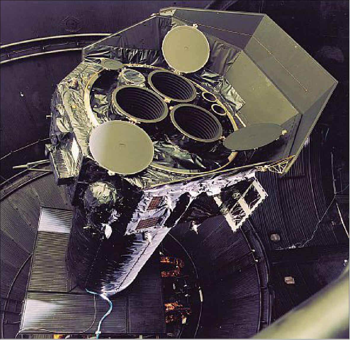 Figure 13: The XMM PFM Lower Module in the Large Space Simulator at ESTEC (January 1999). The Telescope Sun Shield is deployed. The three Mirror Module doors and the Optical Monitor door are open (image credit: ESA) 14)